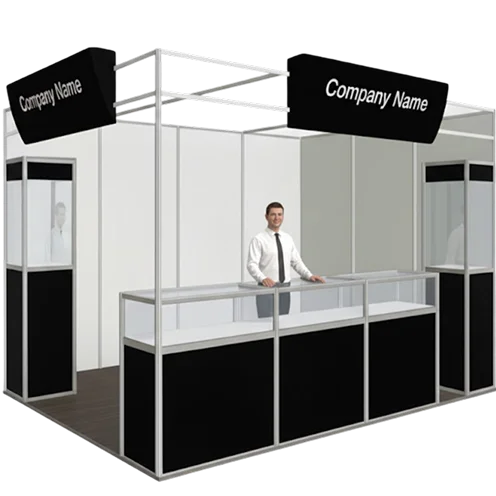 A man poses in front of a booth, showcasing a sign that displays the company's name clearly