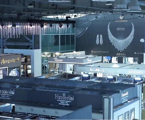 A grand exhibition of jewelry and watches set within a large building, showcasing a variety of exquisite designs
