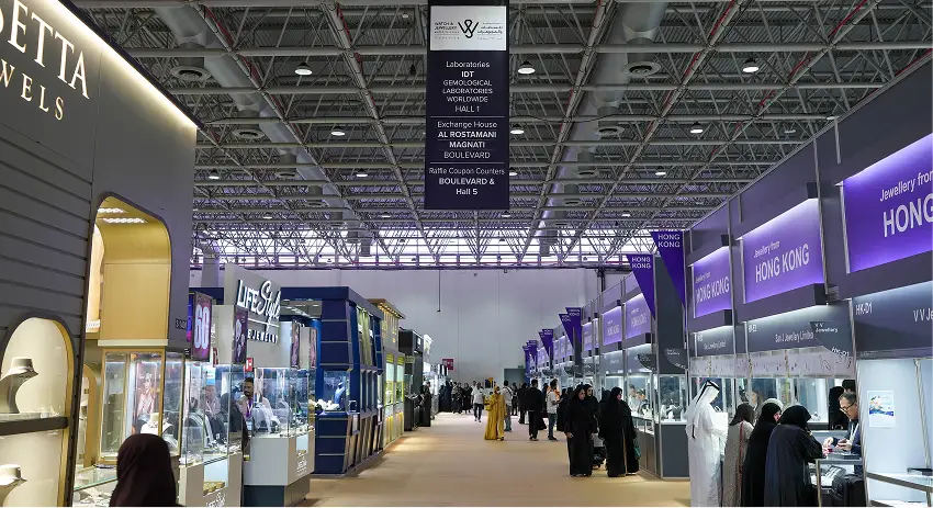 A spacious room showcasing an extensive collection of jewelry and watches displayed elegantly on various surfaces.